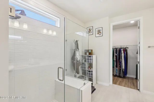 a view of a porch with furniture and a backyard