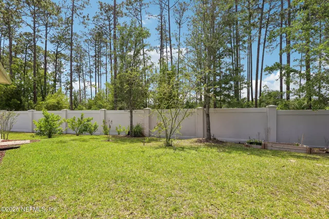 a view of a backyard of the house