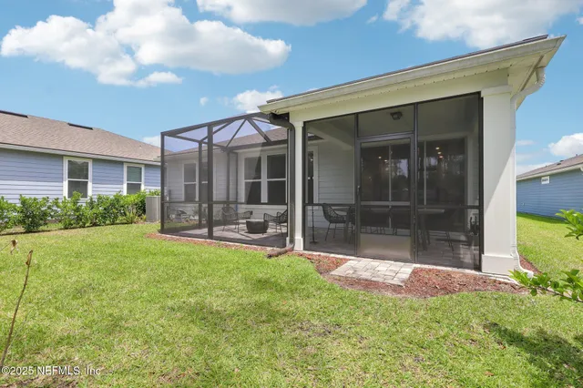 an aerial view of a houses with outdoor space