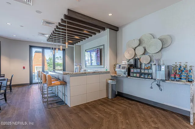 a view of swimming pool with outdoor seating and plants