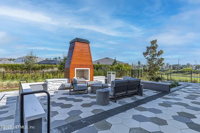 a view of outdoor space with trees and barbeque oven