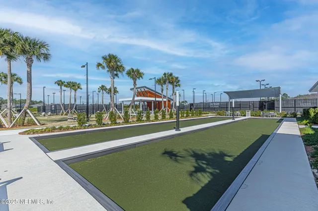 a swimming pool with outdoor seating and yard