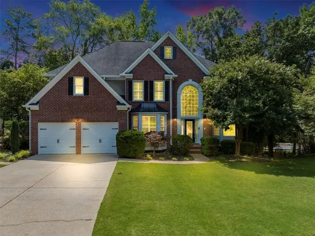 a front view of a house with a yard