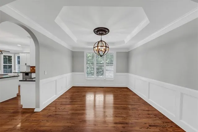 a view of living room with furniture and wooden floor