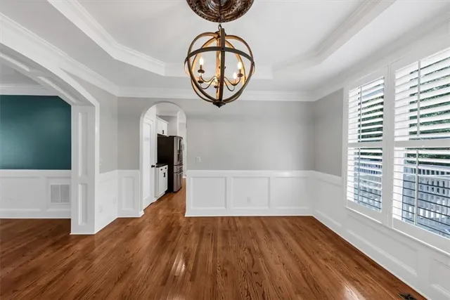a kitchen with stainless steel appliances and refrigerator