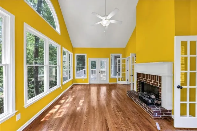 a view of an empty room with a ceiling fan