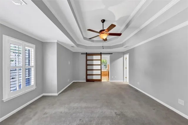 an aerial view of a house with a yard basket ball court