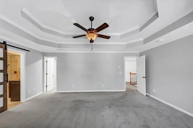an aerial view of a house with a yard and fountain
