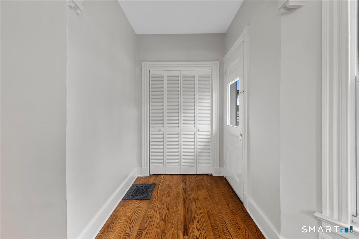 36 Maple Street, Unit 2 New Haven, CT 06511 - Photo 11 of 20 a view of a hallway with wooden floor