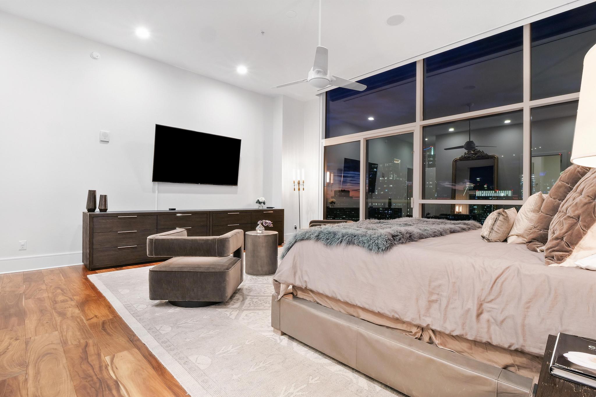 555 East 5th Street, Unit 3022 Austin, TX 78701 - Photo 21 of 40 Bedroom with wood finished floors and recessed lighting
