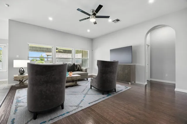 a view of a livingroom with furniture and a window