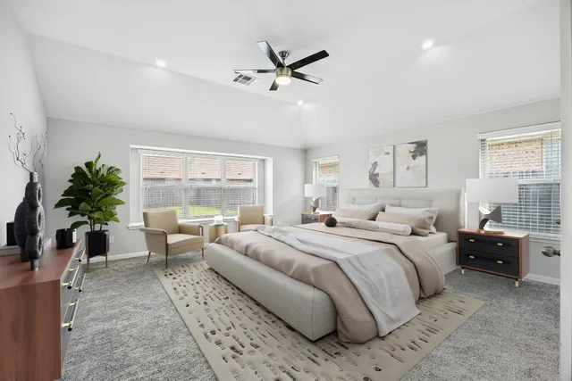 a bed room with a large bed and a window