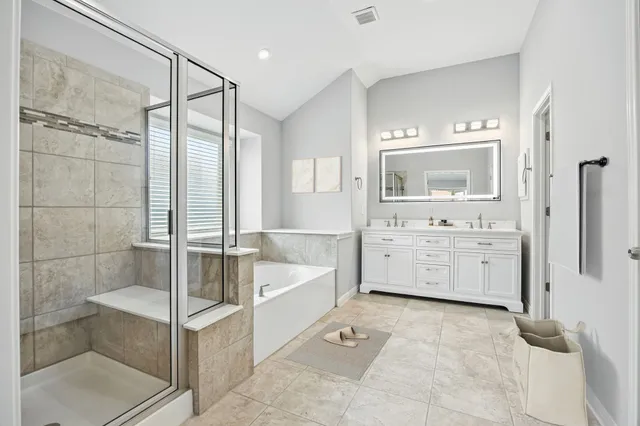 a large house with a big yard and large trees