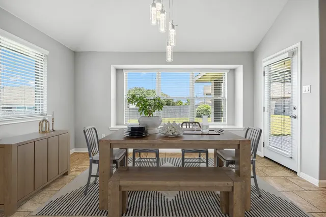 a view of a dining room with furniture window and outside view