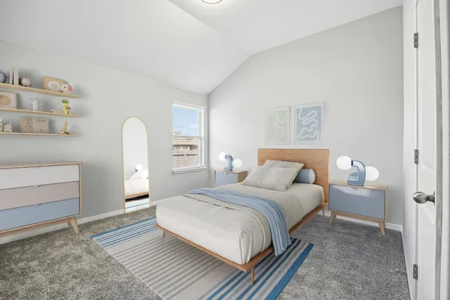 a bedroom with a bed and a cabinets