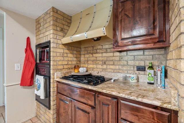 a living room with couches and a flat screen tv