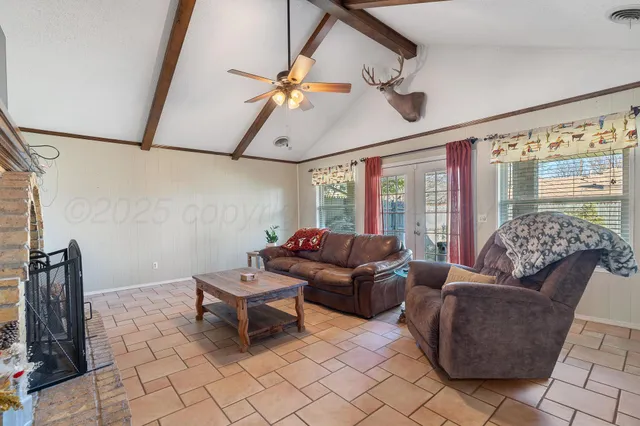 a living room with furniture and a window