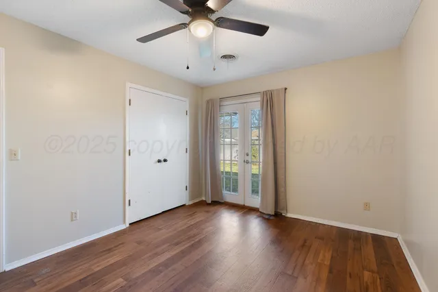 a bedroom with bed and a chandelier