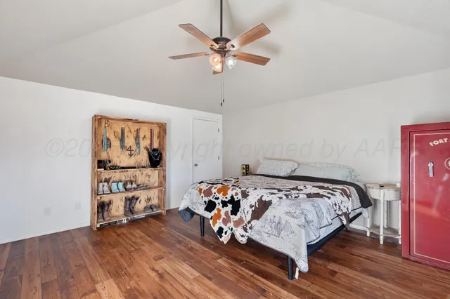 a bedroom with bed and a window