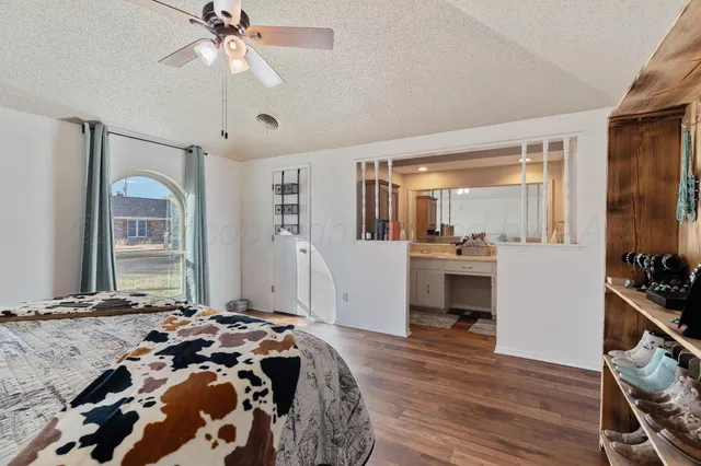 a bathroom with a sink a mirror and a shower