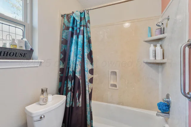 a bathroom with a sink double vanity and a toilet