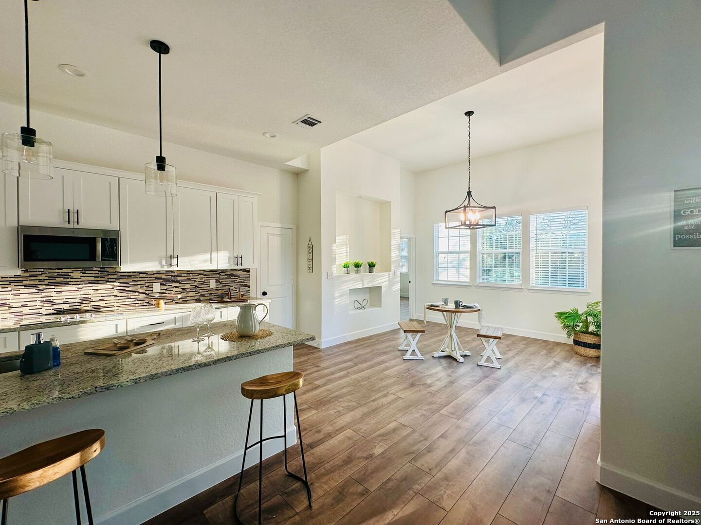 1064 Overbrook Lane Spring Branch, TX 78070 - Photo 12 of 34 a kitchen with a table chairs stove and cabinets
