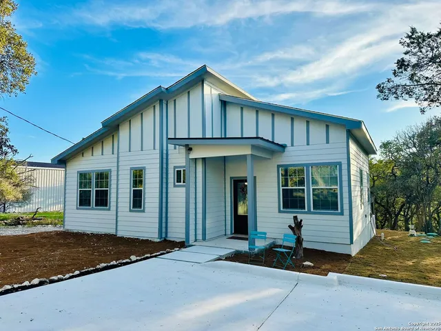 a view of a house with a iron gate