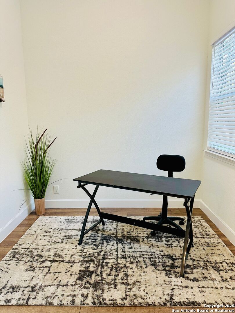 1064 Overbrook Lane Spring Branch, TX 78070 - Photo 5 of 34 a bench sitting in middle of a room