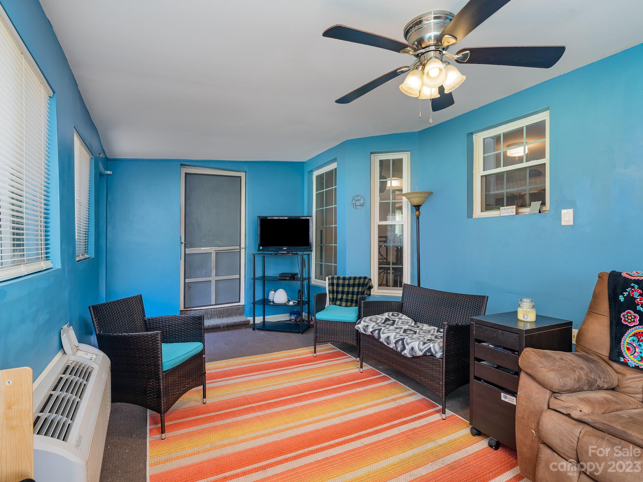 12119 Shadow Ridge Lane Charlotte, NC 28273 - Photo 13 of 28 a bedroom with a bed a couch and a chandelier