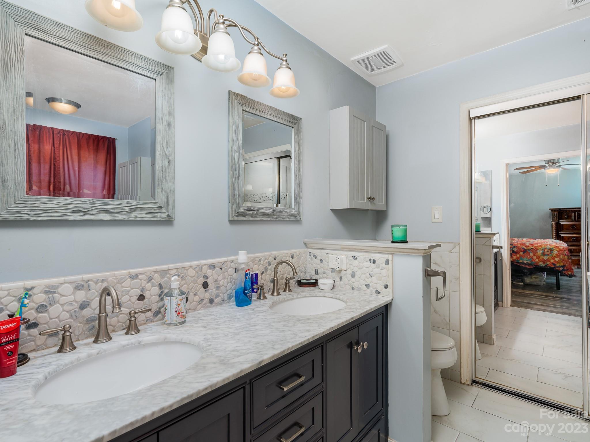 12119 Shadow Ridge Lane Charlotte, NC 28273 - Photo 17 of 28 a bathroom with a sink and a mirror