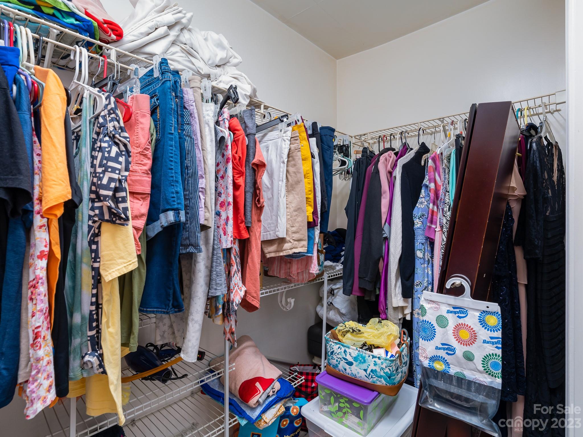12119 Shadow Ridge Lane Charlotte, NC 28273 - Photo 19 of 28 a view of walk in closet with clothes and shoes