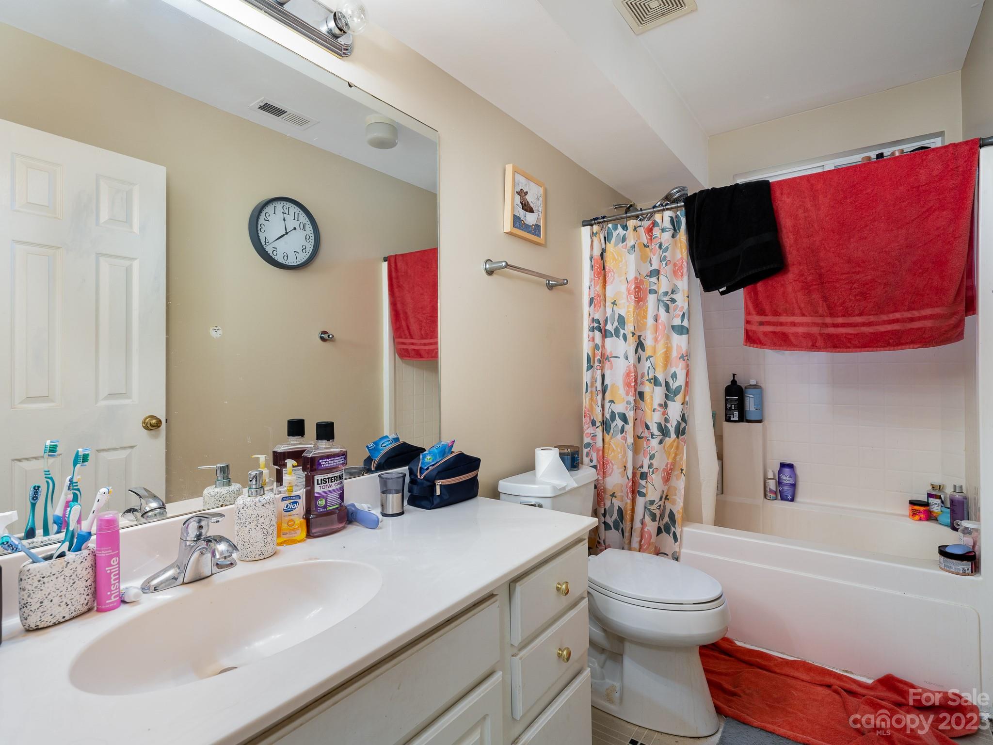 12119 Shadow Ridge Lane Charlotte, NC 28273 - Photo 22 of 28 a bathroom with a sink vanity mirror bathtub and toilet