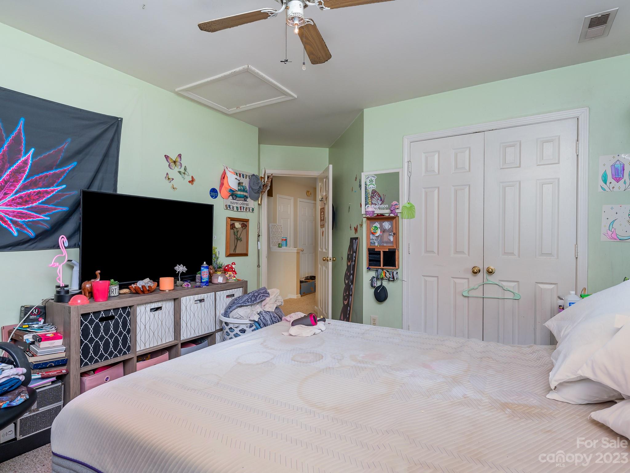 12119 Shadow Ridge Lane Charlotte, NC 28273 - Photo 24 of 28 a bedroom with a bed and flat screen tv