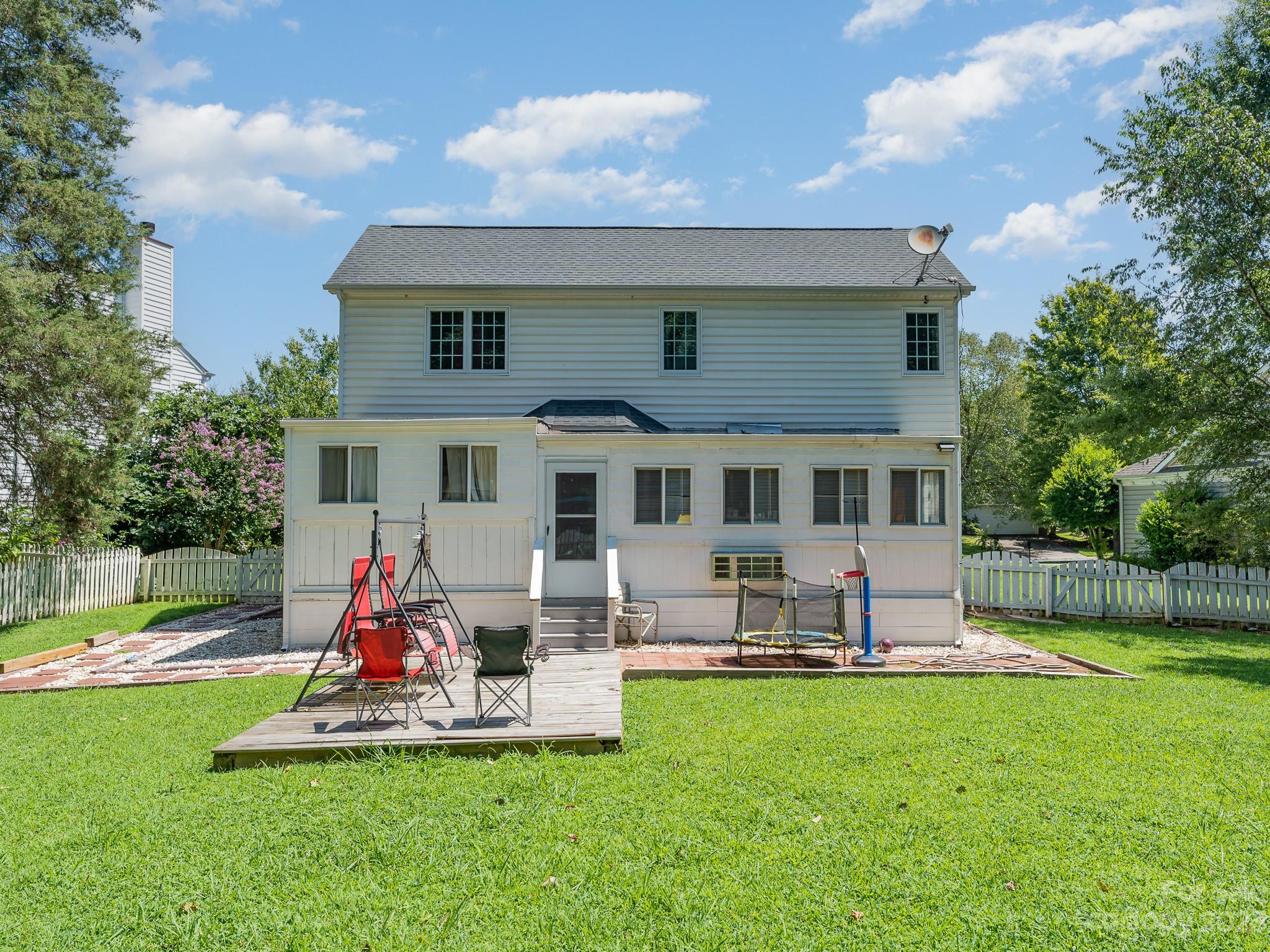 12119 Shadow Ridge Lane Charlotte, NC 28273 - Photo 26 of 28 a front view of house with yard and outdoor seating