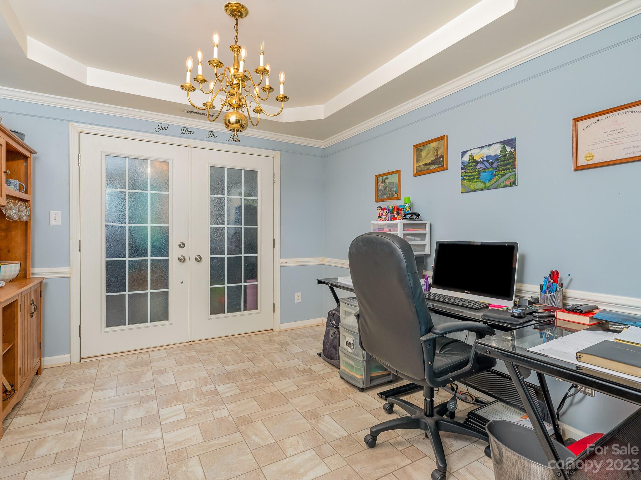 12119 Shadow Ridge Lane Charlotte, NC 28273 - Photo 7 of 28 a view of a workspace with furniture and a chandelier