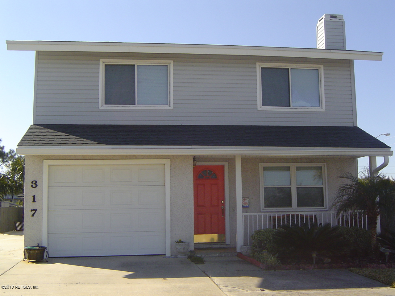 a front view of a house with a garage