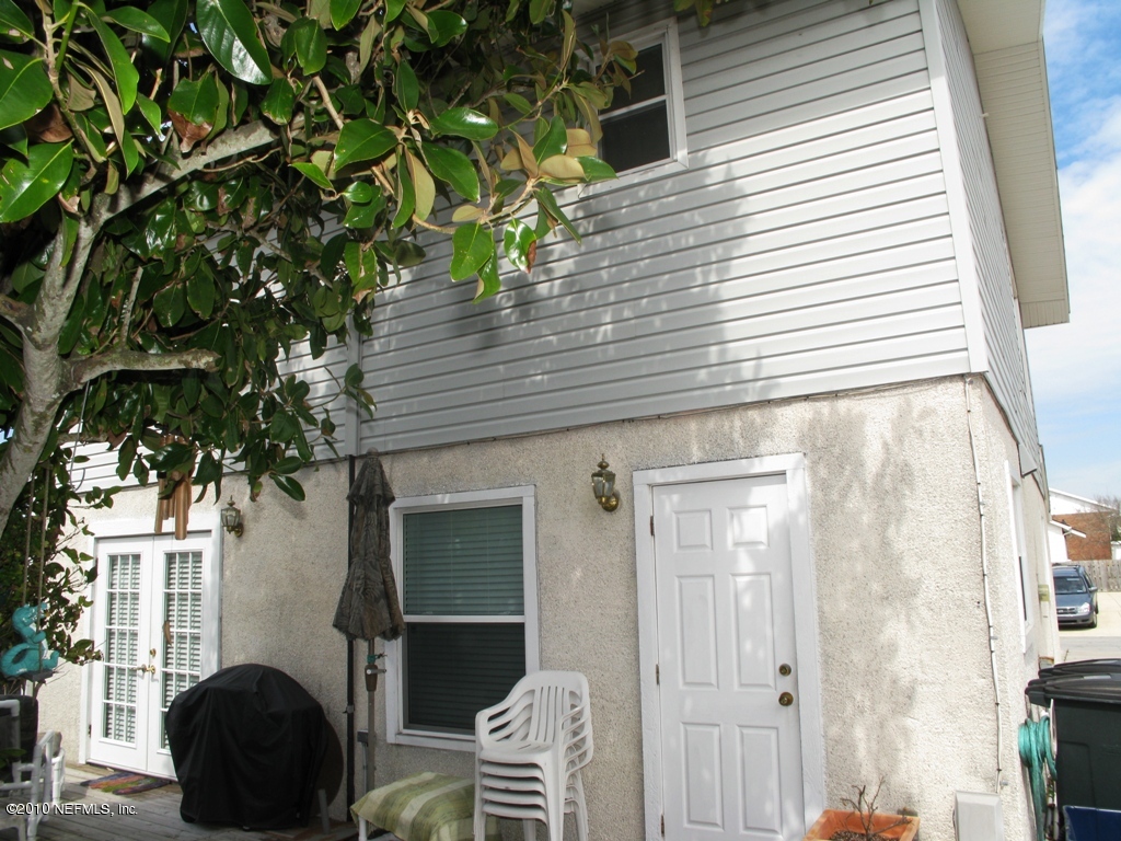 317 Magnolia Street Neptune Beach, FL 32266 - Photo 13 of 13 a front view of a house with a garden