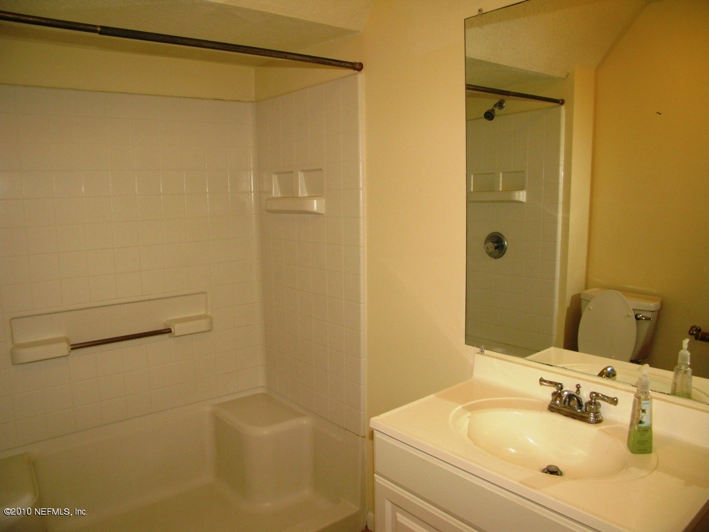 317 Magnolia Street Neptune Beach, FL 32266 - Photo 7 of 13 a bathroom with a sink and a mirror