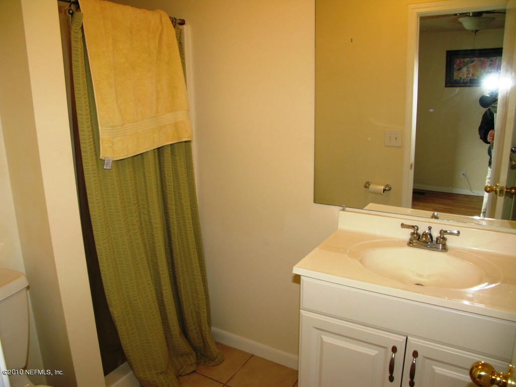 317 Magnolia Street Neptune Beach, FL 32266 - Photo 8 of 13 a bathroom with a sink and a mirror
