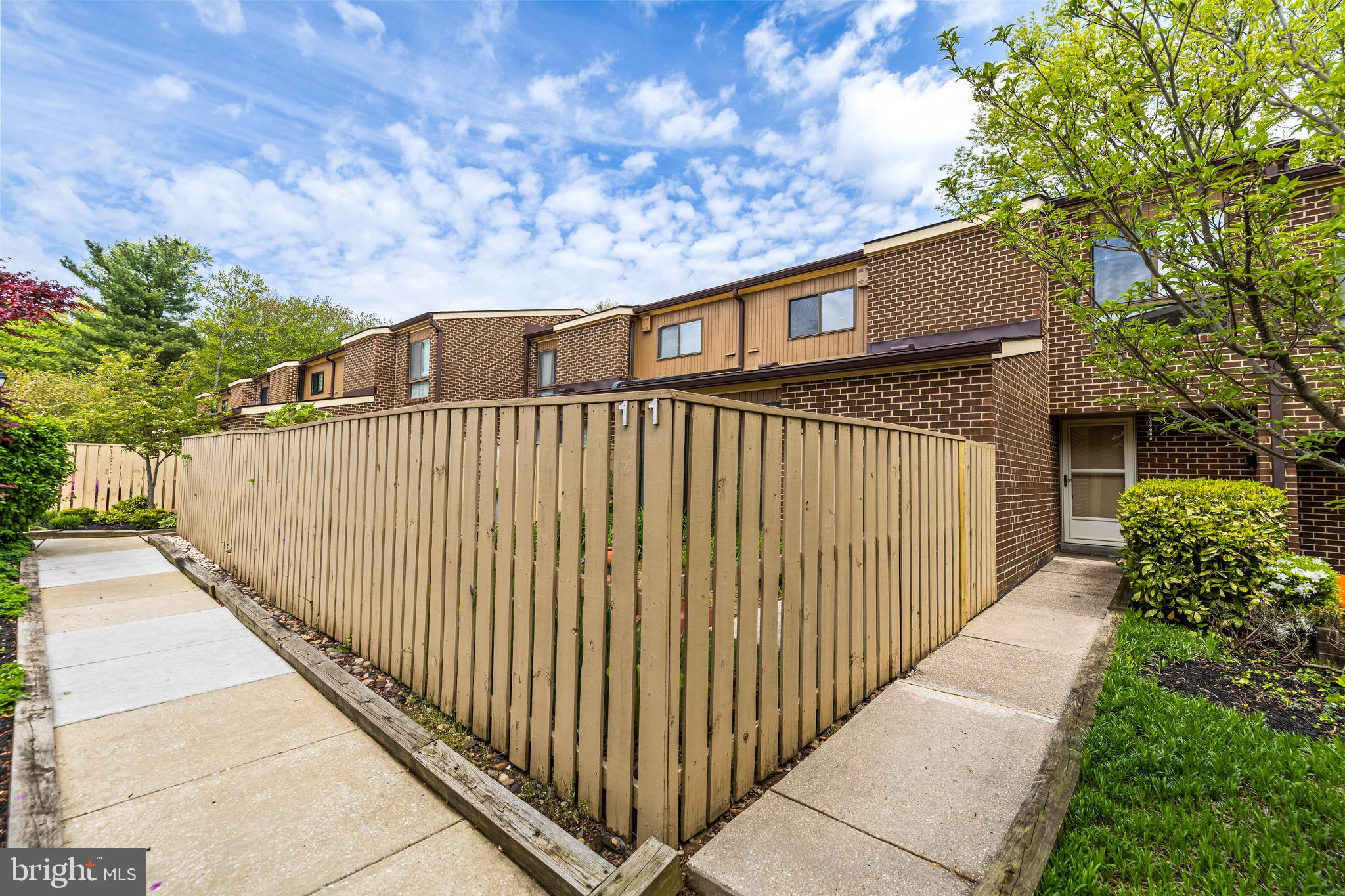 11 Tanner Court, Unit G Baltimore, MD 21208 - Photo 1 of 38 a view of a wooden fence and a pathway