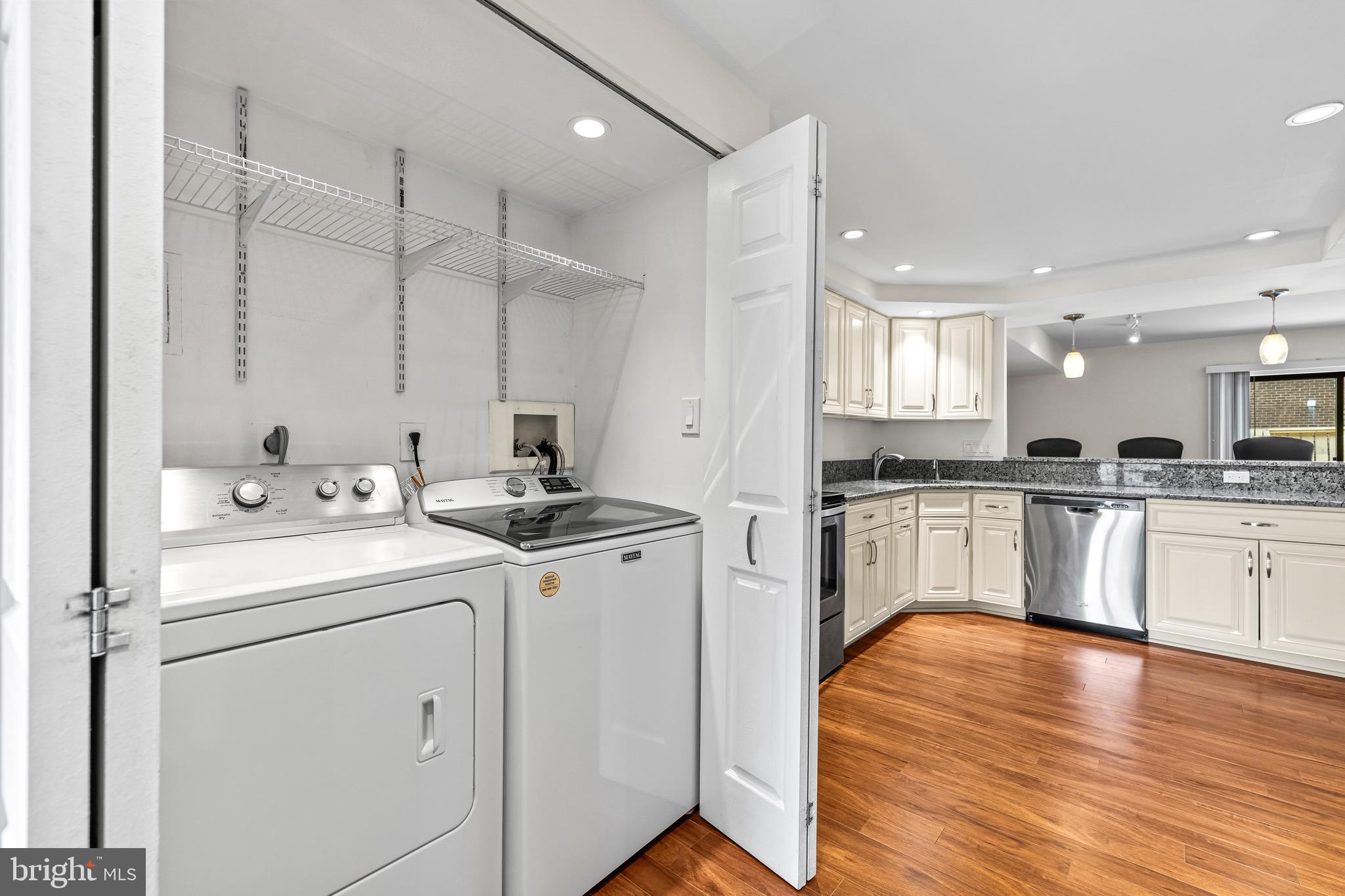 11 Tanner Court, Unit G Baltimore, MD 21208 - Photo 17 of 38 a kitchen with granite countertop a sink appliances cabinets and wooden floor