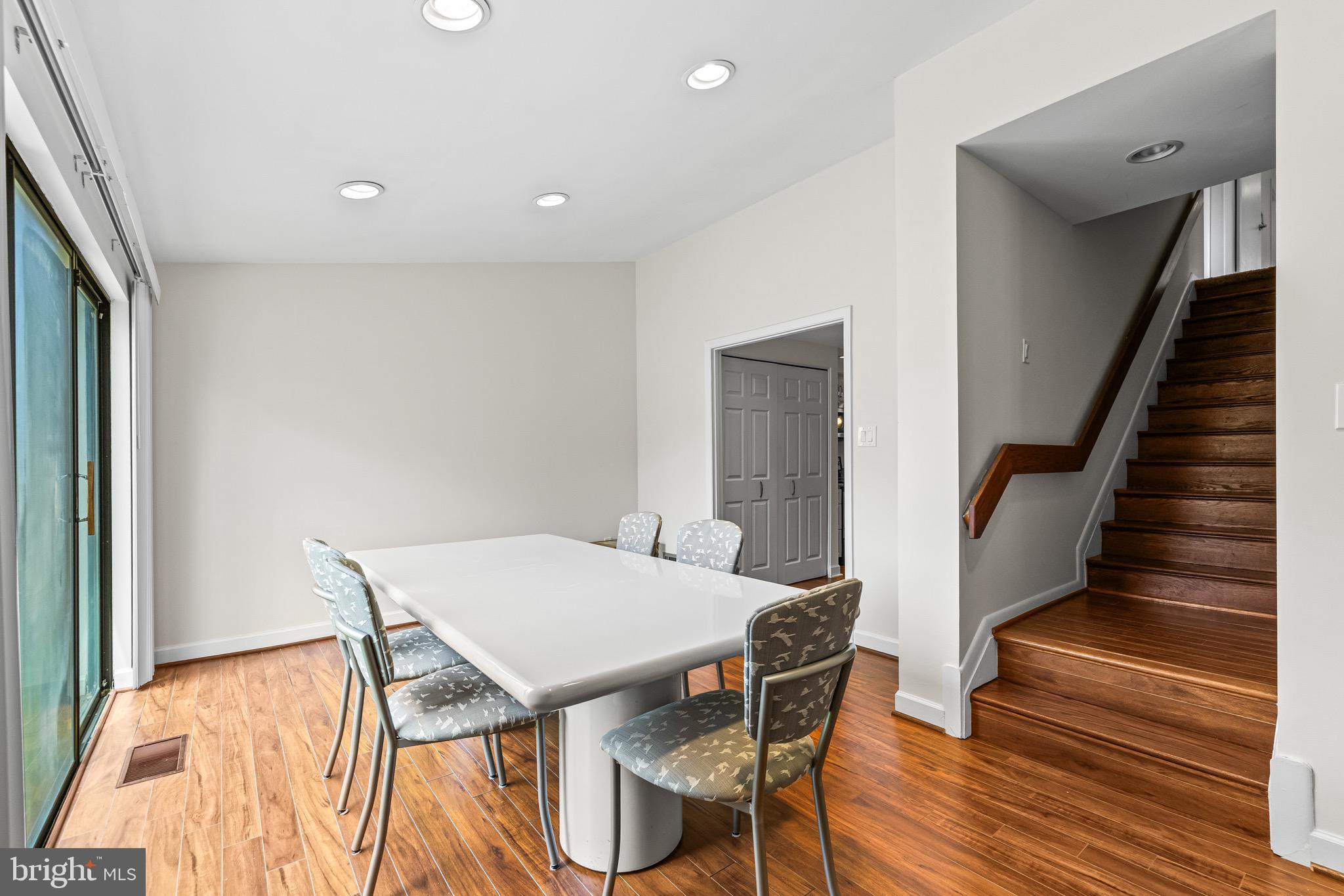 11 Tanner Court, Unit G Baltimore, MD 21208 - Photo 20 of 38 a view of a dining room with furniture and wooden floor