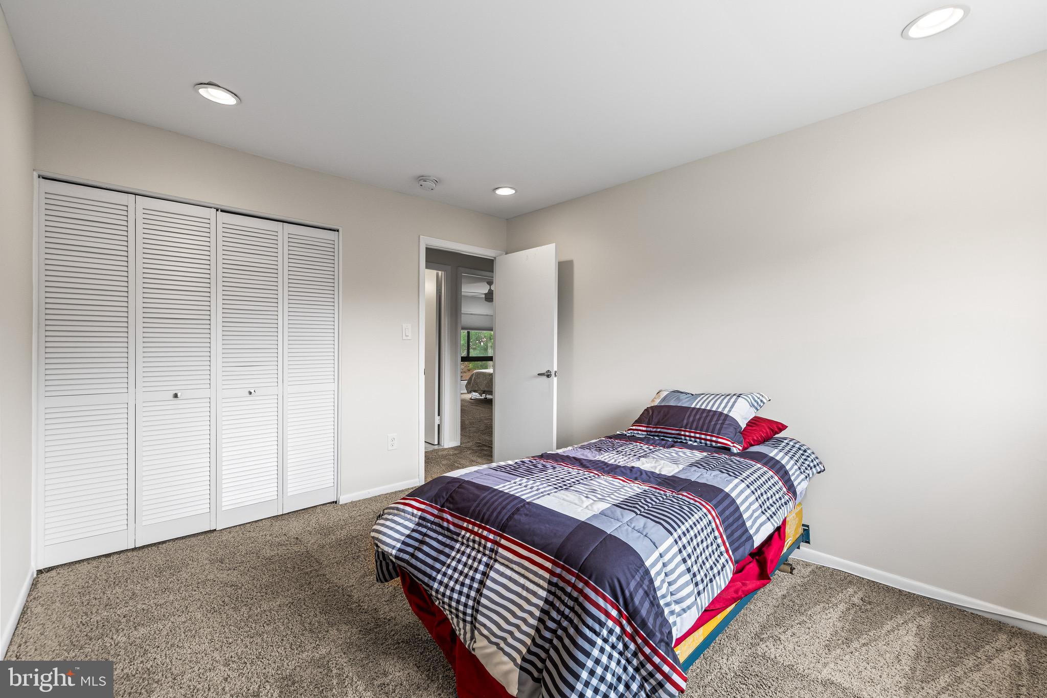 11 Tanner Court, Unit G Baltimore, MD 21208 - Photo 23 of 38 a bedroom with a bed and a painting