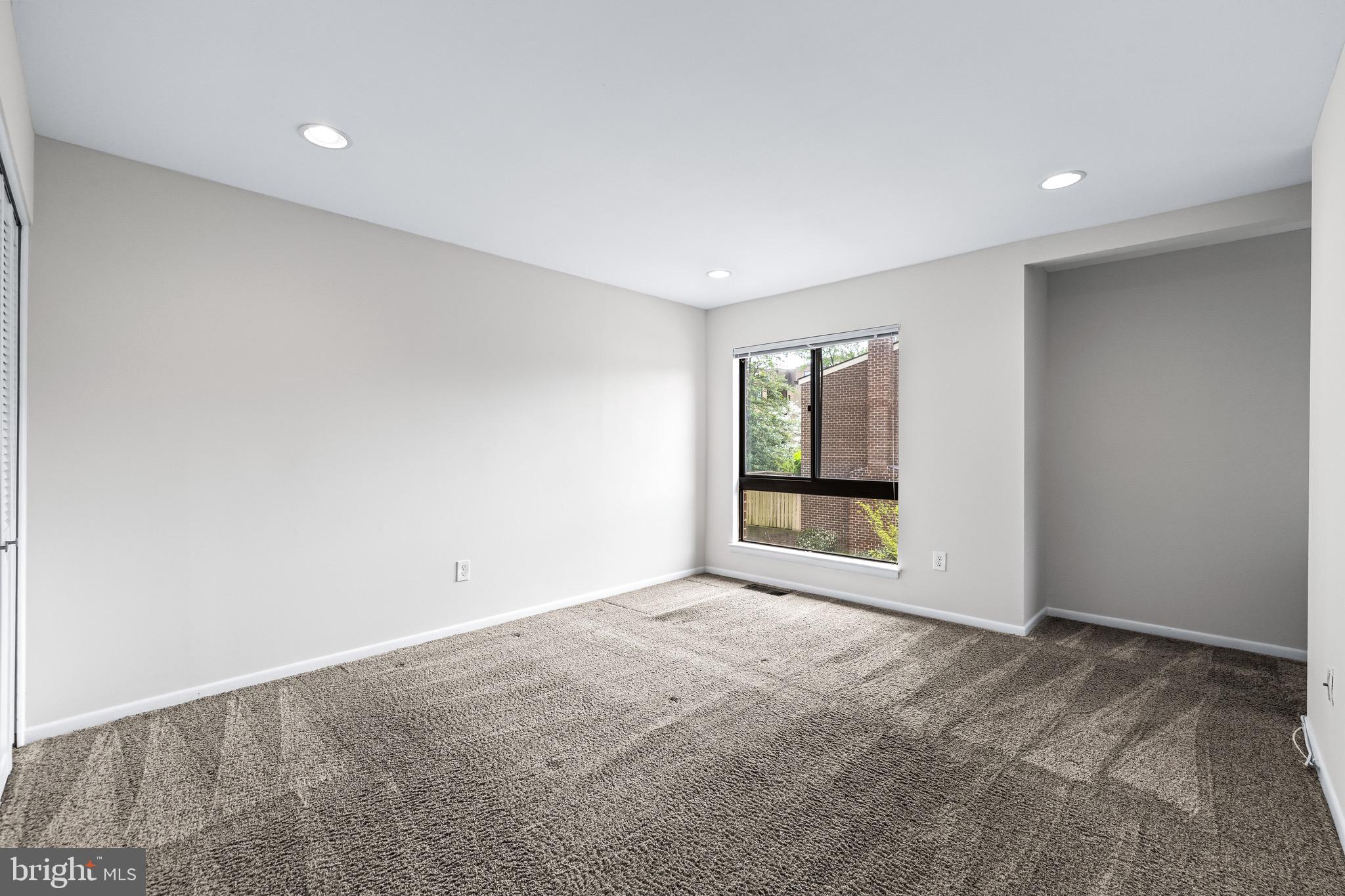 11 Tanner Court, Unit G Baltimore, MD 21208 - Photo 24 of 38 a view of an empty room with a window