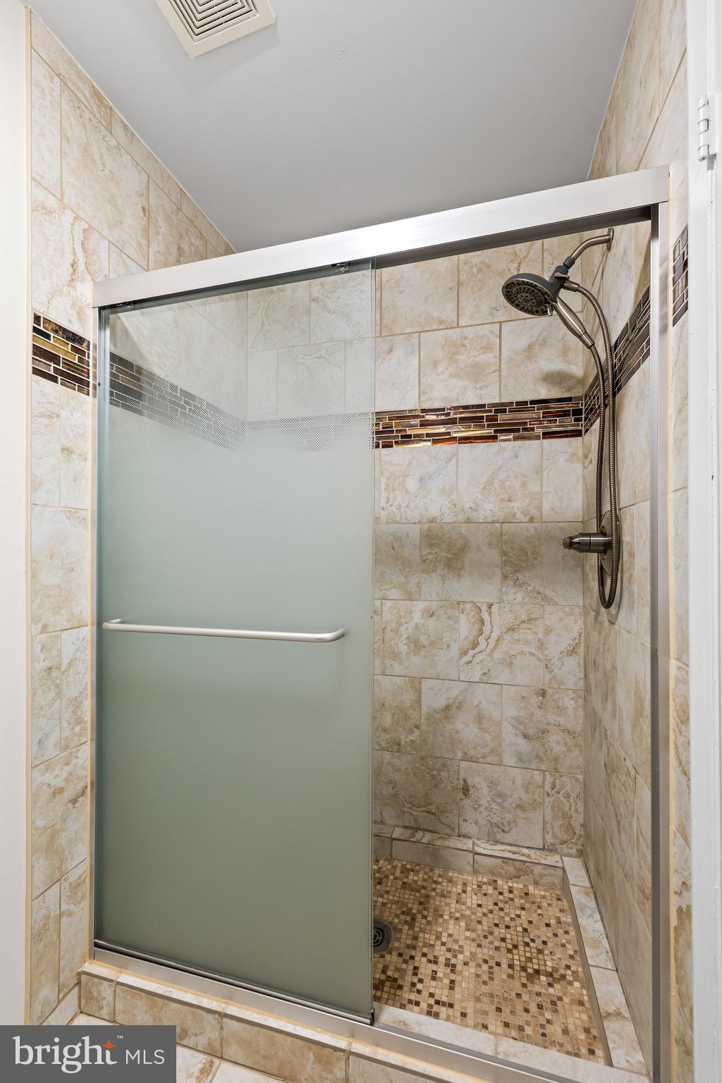 11 Tanner Court, Unit G Baltimore, MD 21208 - Photo 33 of 38 a bathroom with a glass door shower