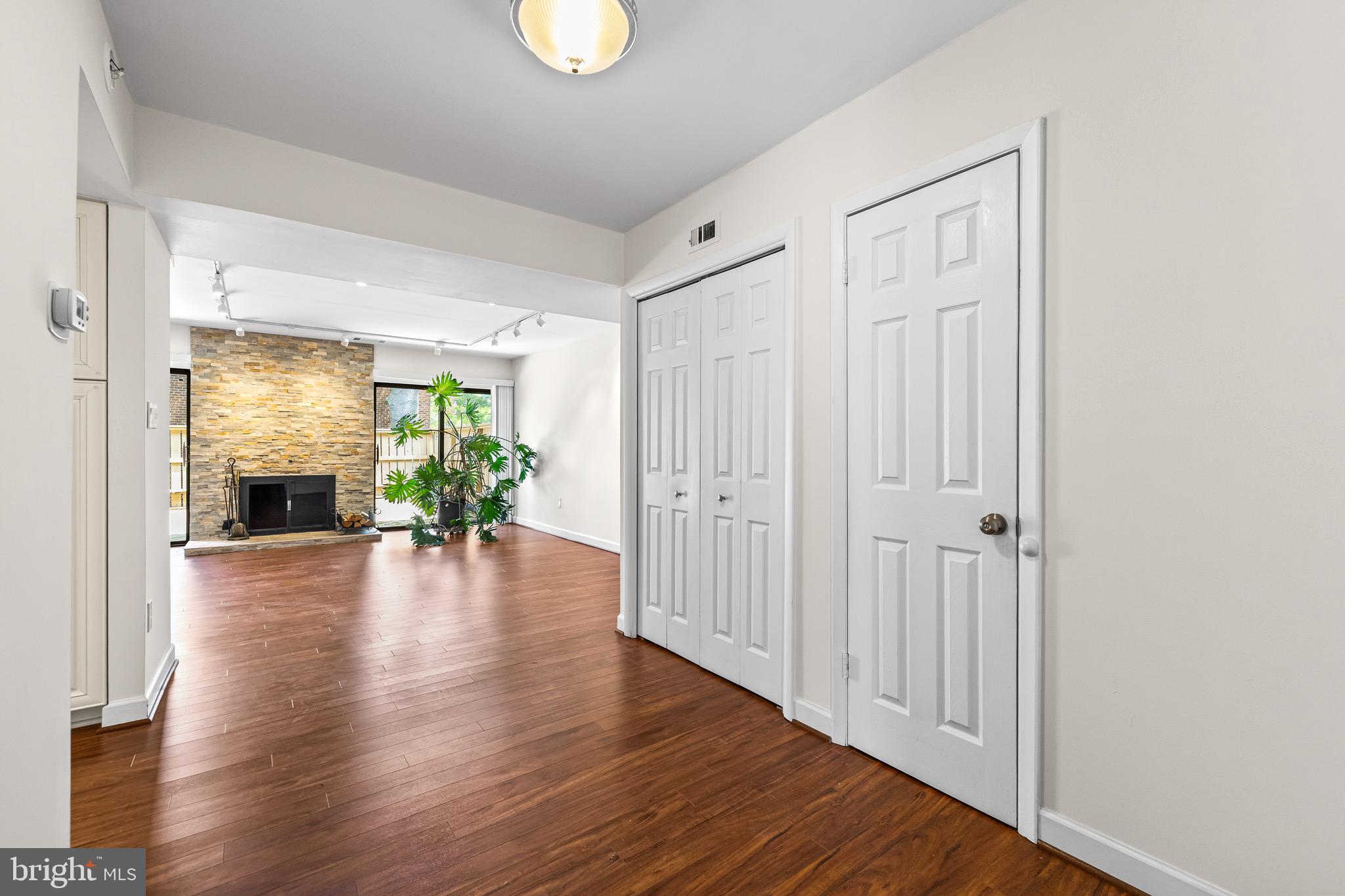 11 Tanner Court, Unit G Baltimore, MD 21208 - Photo 4 of 38 a view of a hallway with wooden floor and a livingroom