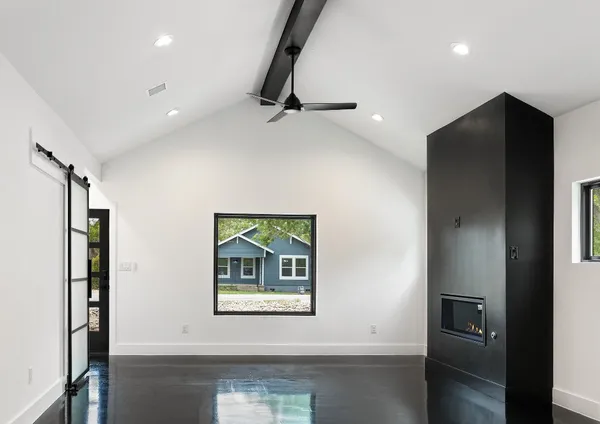 a view of an empty room with a window
