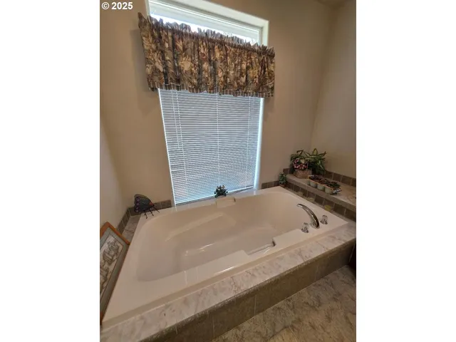 a bathroom with a tub and sink