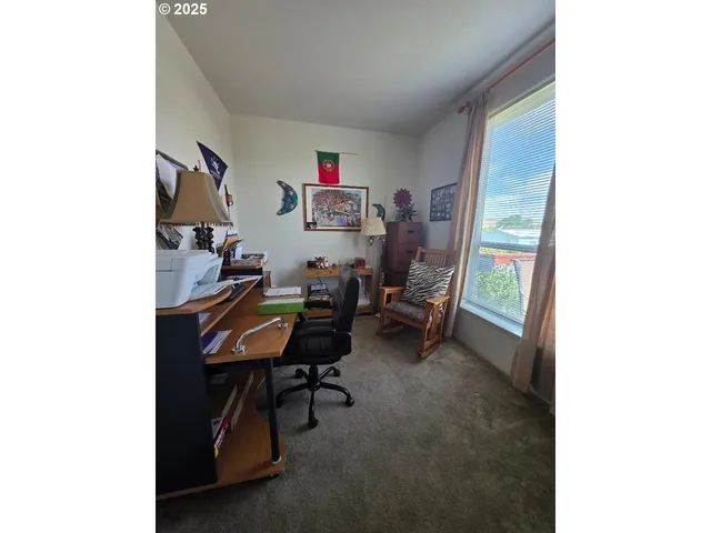 a view of a workspace with furniture