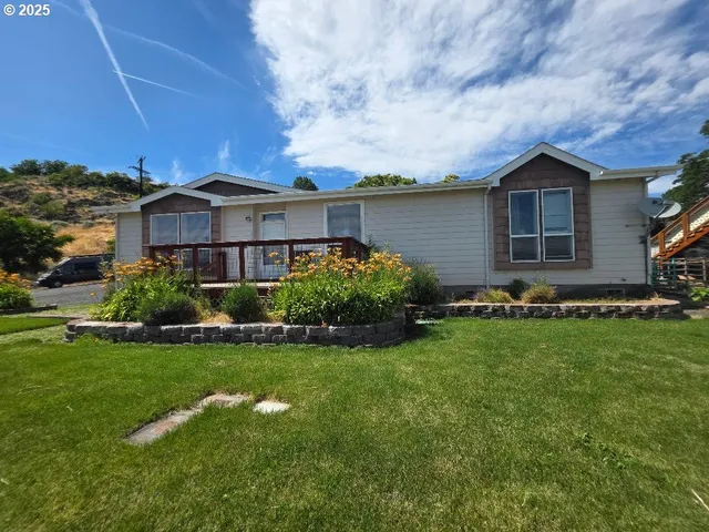 a view of a garden with wooden floor